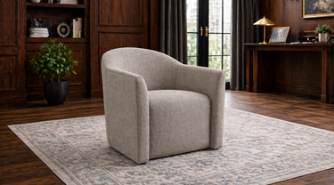 Gray tritono accent chair in a masculine, dark wood office