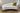 White Lagoon loveseat with a gold-pattern accent pillow
