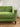 Detail of the Salvatore sofa's straight arm, seat cushion and tapered leg in green upholstery