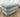 Angled view of the rectangular Stacked Candy ottoman