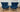 Pair of blue Tuulla chairs with tall channelled backs and dark legs