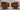Front and back views of rust-colored Orion chairs on circular wood bases