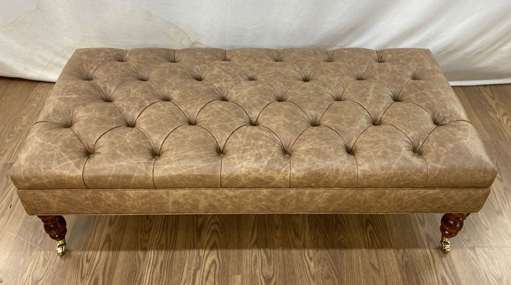 Diamond tufted ottoman in leather