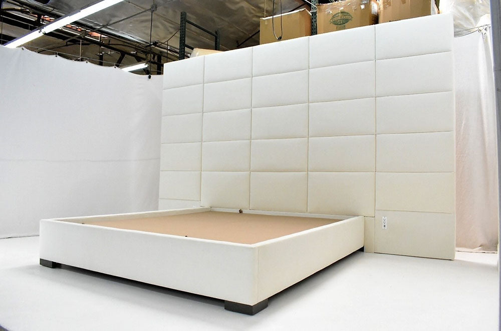 California King bed with paneled headboard
