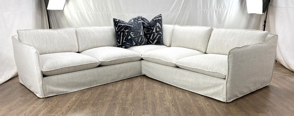 Slipcovered sectional in Active Concerto Sand