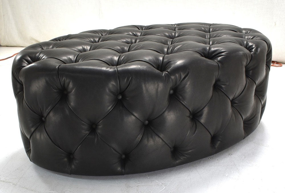 Diamond tufted ottoman in leather