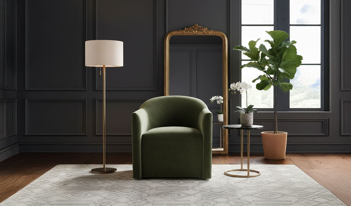 Olive green Dimitri chair in a room with dark paneling, a brass lamp and a gold mirror